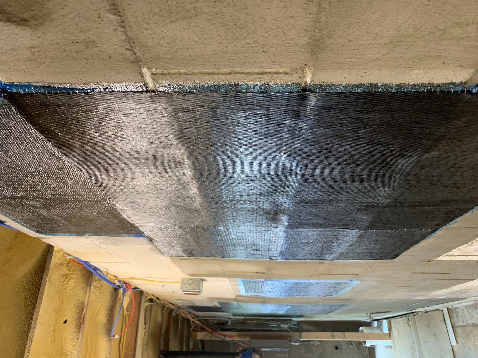 Second view of completed masonry waterproofing repair on basement wall