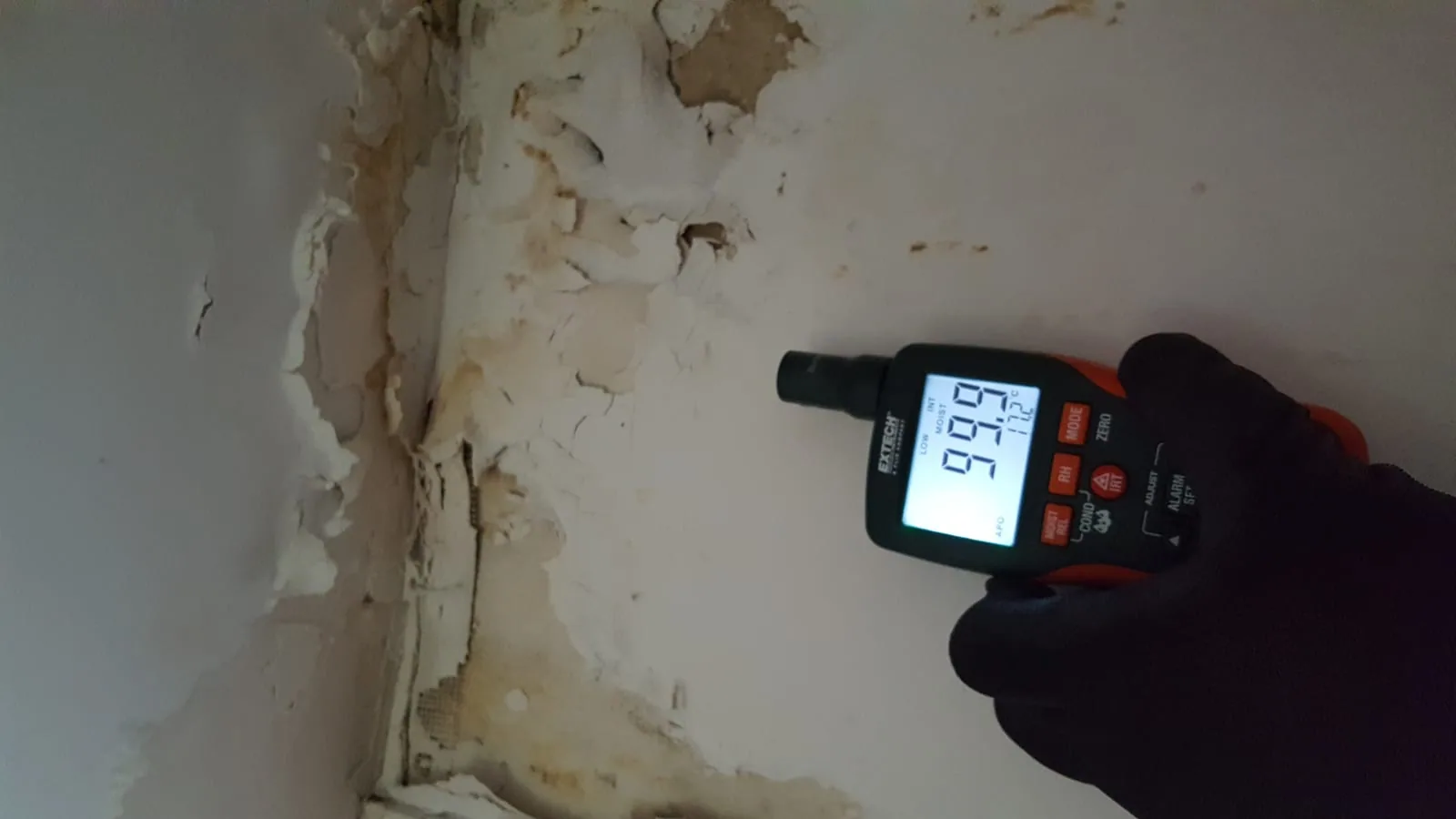Moisture detection during basement waterproofing inspection by 911 Storm technician
