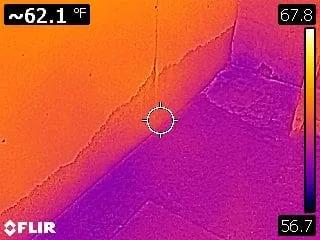 Infrared thermal scan locating the moisture source feeding mold growth behind a wall
