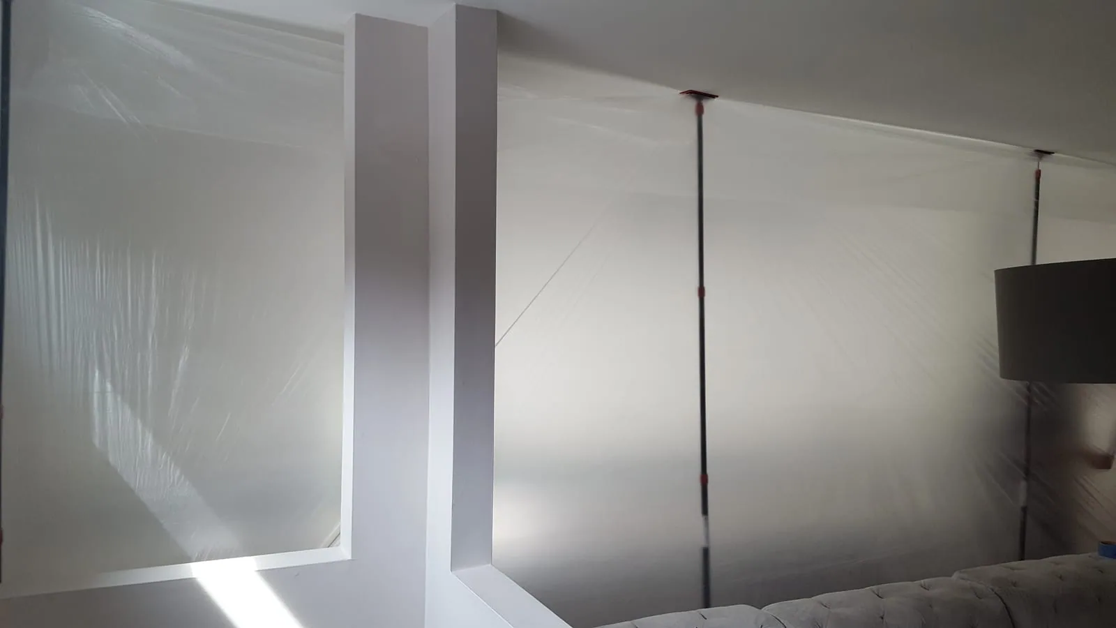 Mold remediation containment with plastic sheeting set up inside a Connecticut home