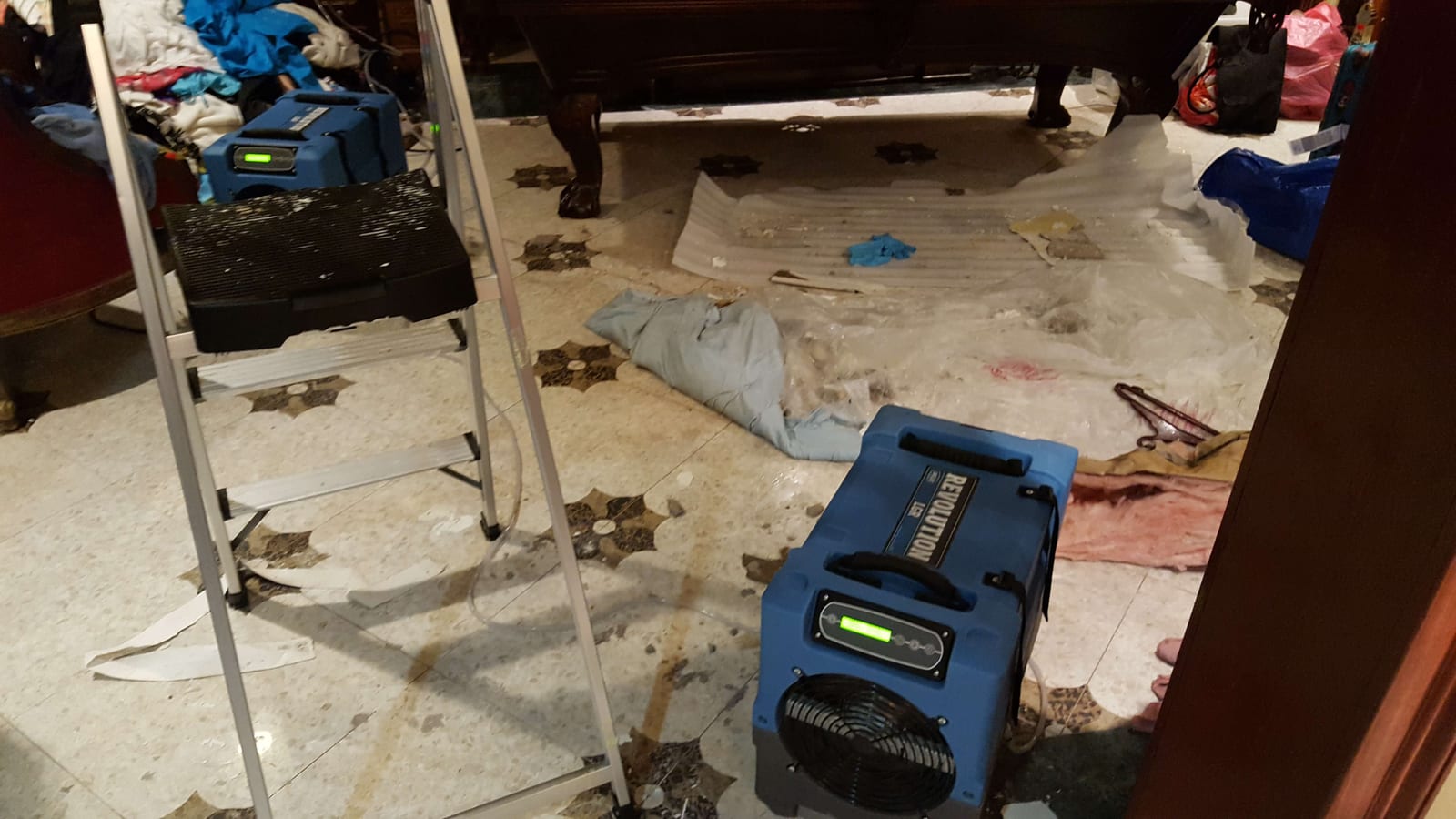 911 Storm crew running industrial dehumidifiers and air movers during active water damage drying in Greenwich, CT