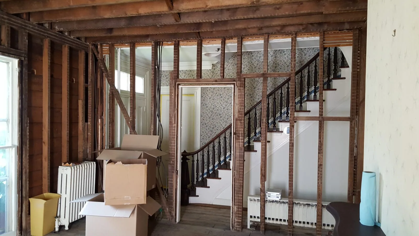 Interior demolition removing saturated drywall during water damage restoration
