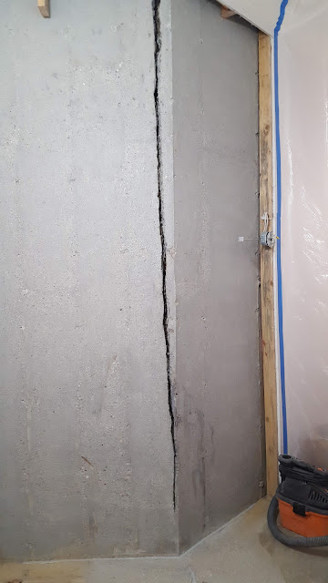 Water actively leaking through foundation wall crack