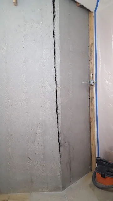 Water leaking through a foundation wall, an early warning sign of water damage in a Fairfield County home