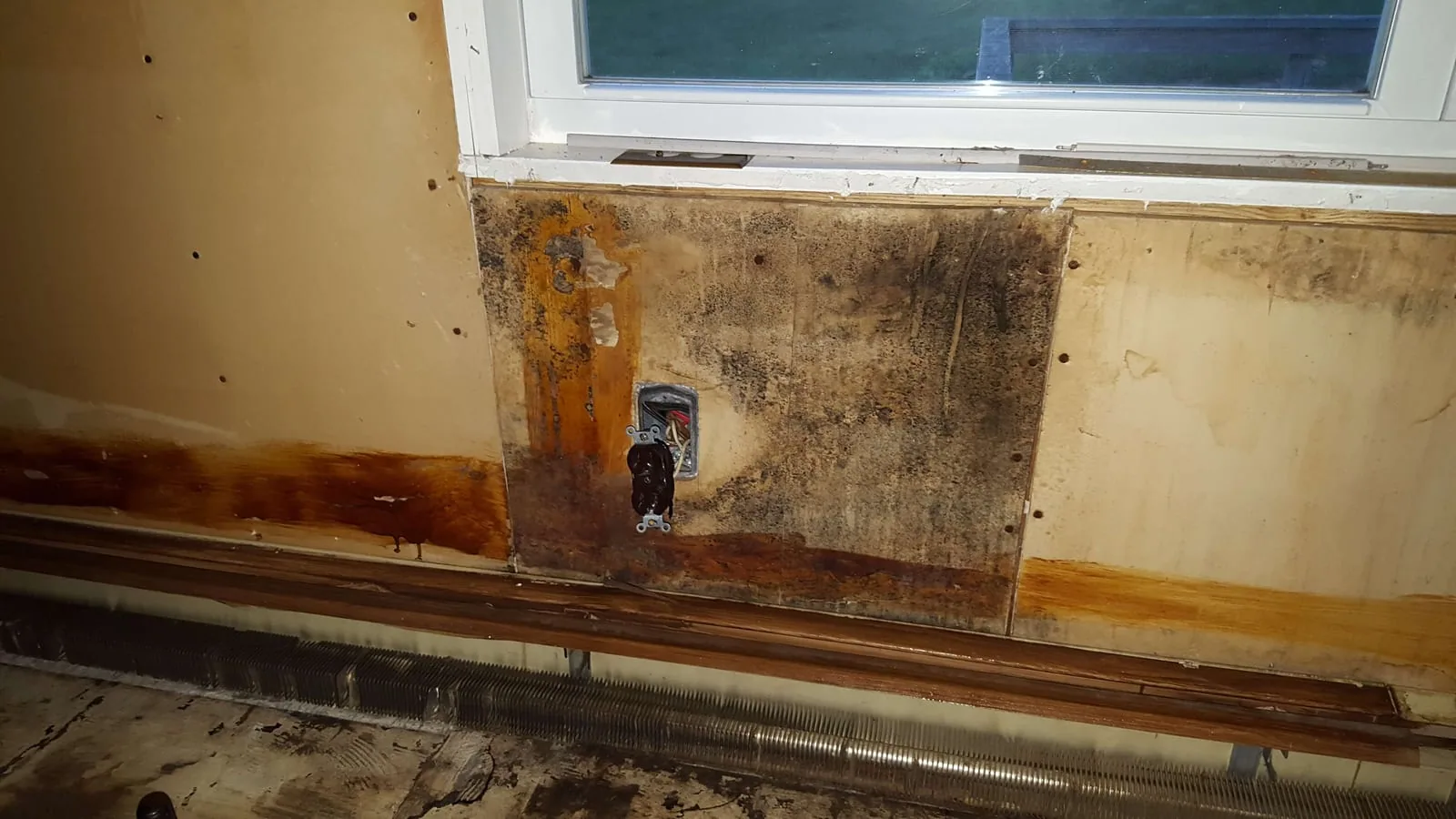 Water-damaged materials exposed after demolition in a Connecticut home, showing the reach of water intrusion
